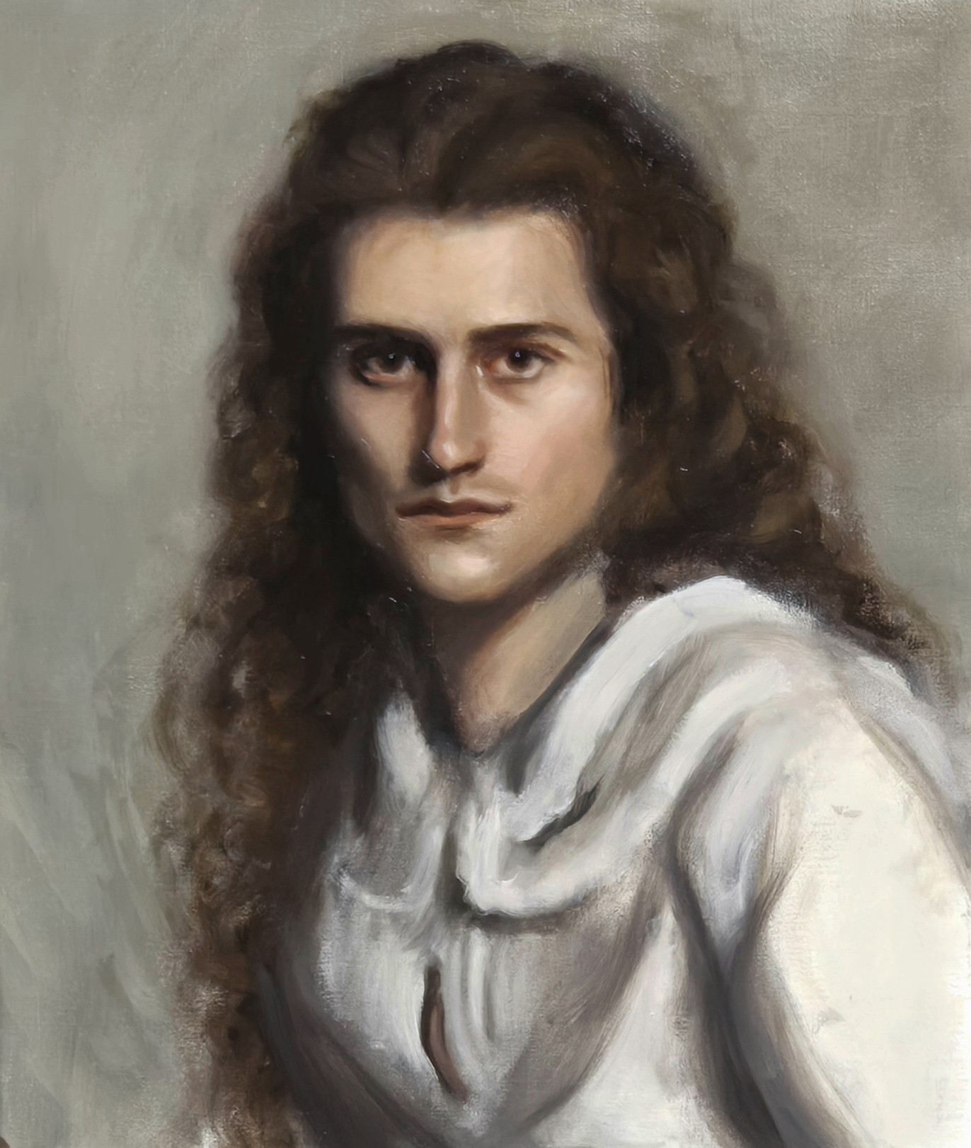 Portrait of a long-haired man in a white shirt