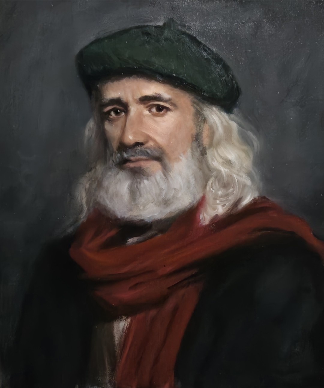 Portrait of a white-haired bearded man in a green cap and red scarf