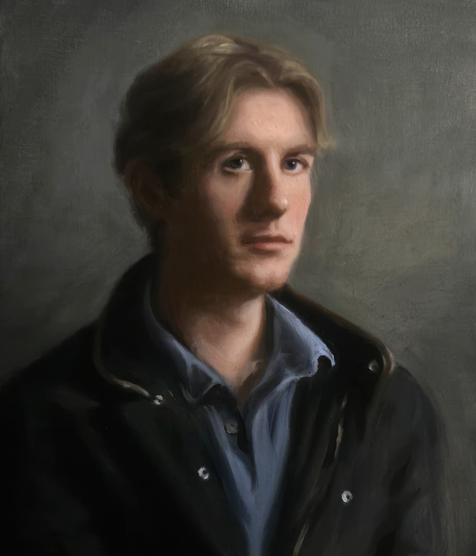 Portrait of a fair-haired man wearing a dark jacket